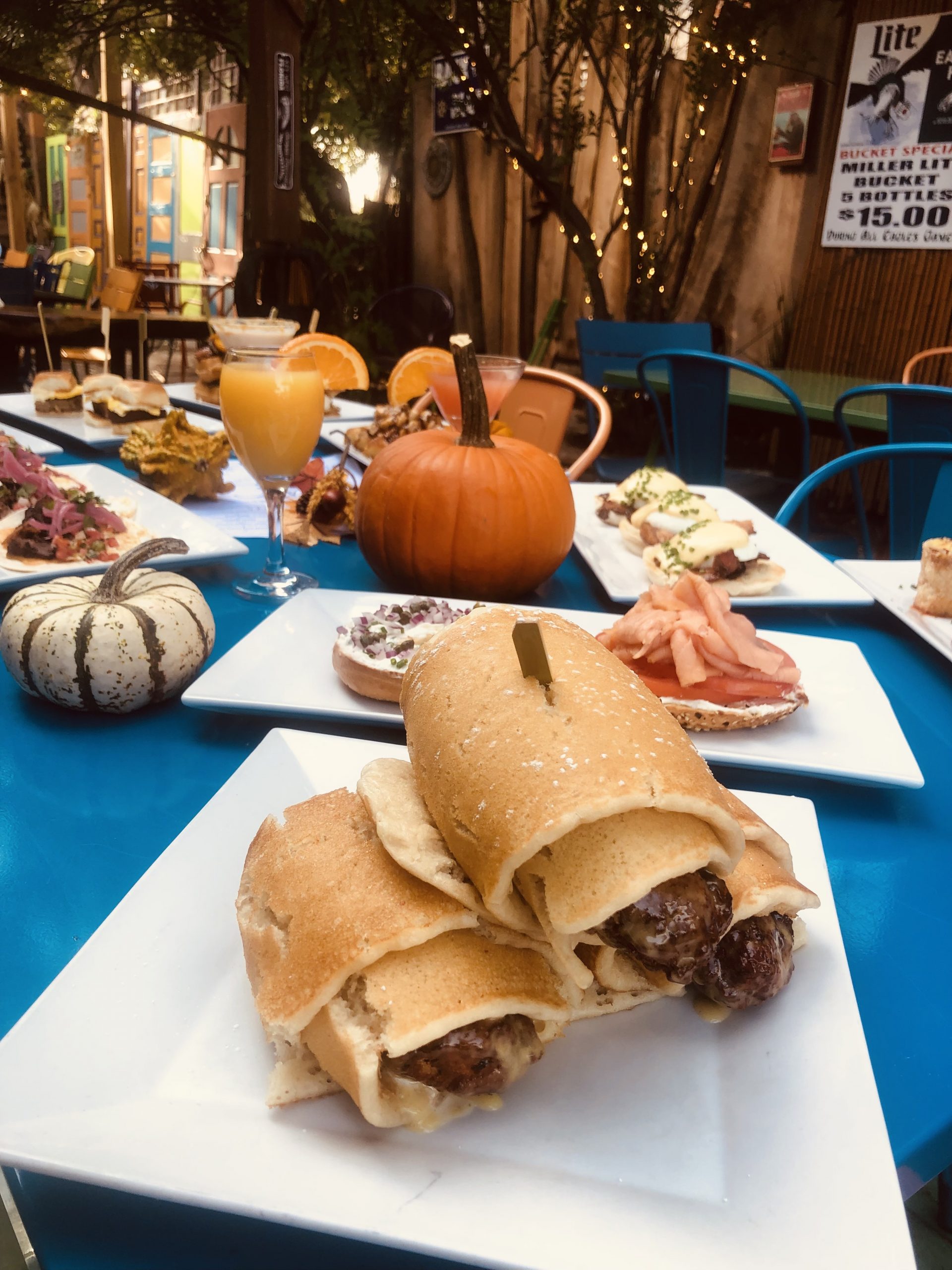 A table full of food on a blue table.